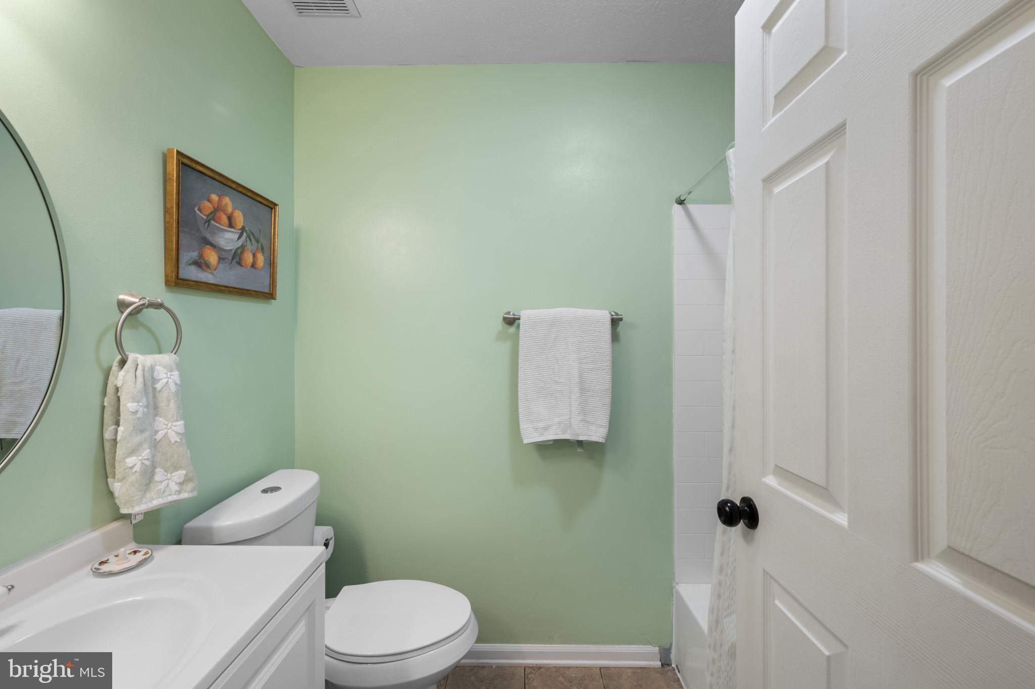 3105 Cardinal Way, Unit L Abingdon, MD 21009 - Photo 22 of 31 a white toilet sitting next to a bathroom sink