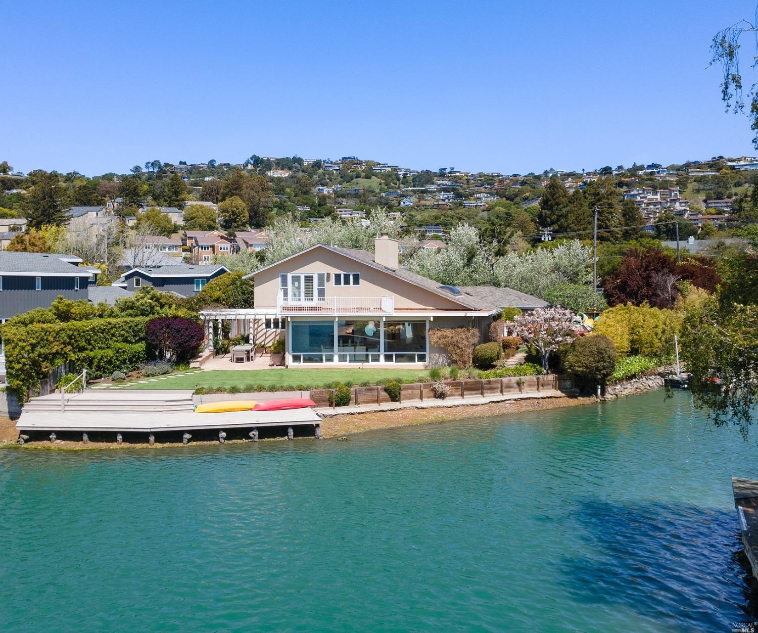 a view of a town with swimming pool and mountains