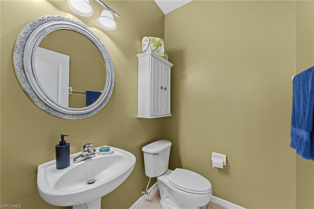 21632 Windham Run Estero, FL 33928 - Photo 20 of 50 a bathroom with a toilet sink and mirror