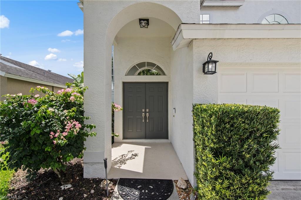 21632 Windham Run Estero, FL 33928 - Photo 2 of 50 a view of a entryway door of the house