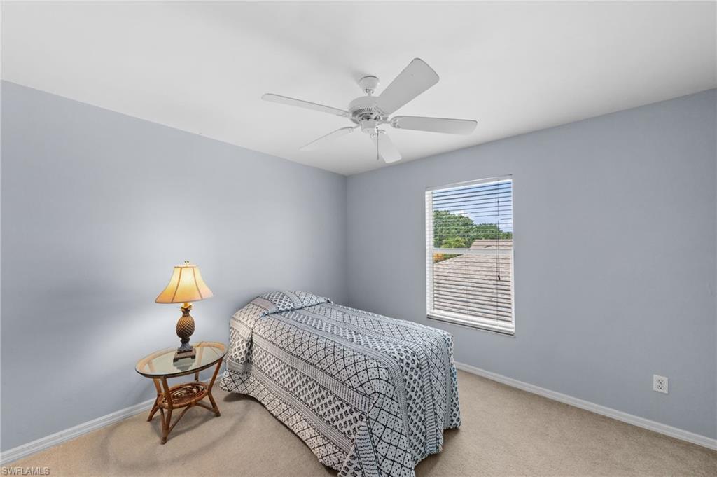 21632 Windham Run Estero, FL 33928 - Photo 28 of 50 a bedroom with a bed and window
