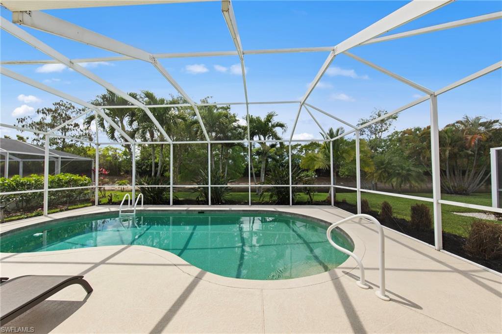 21632 Windham Run Estero, FL 33928 - Photo 32 of 50 a view of a backyard with a swimming pool