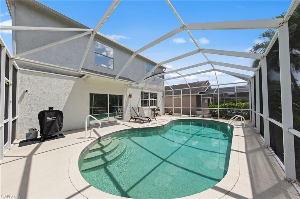 21632 Windham Run Estero, FL 33928 - Photo 34 of 50 a view of a kitchen with a table and chairs