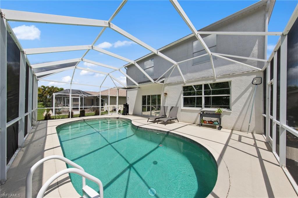 21632 Windham Run Estero, FL 33928 - Photo 35 of 50 a view of a house with swimming pool and sitting area
