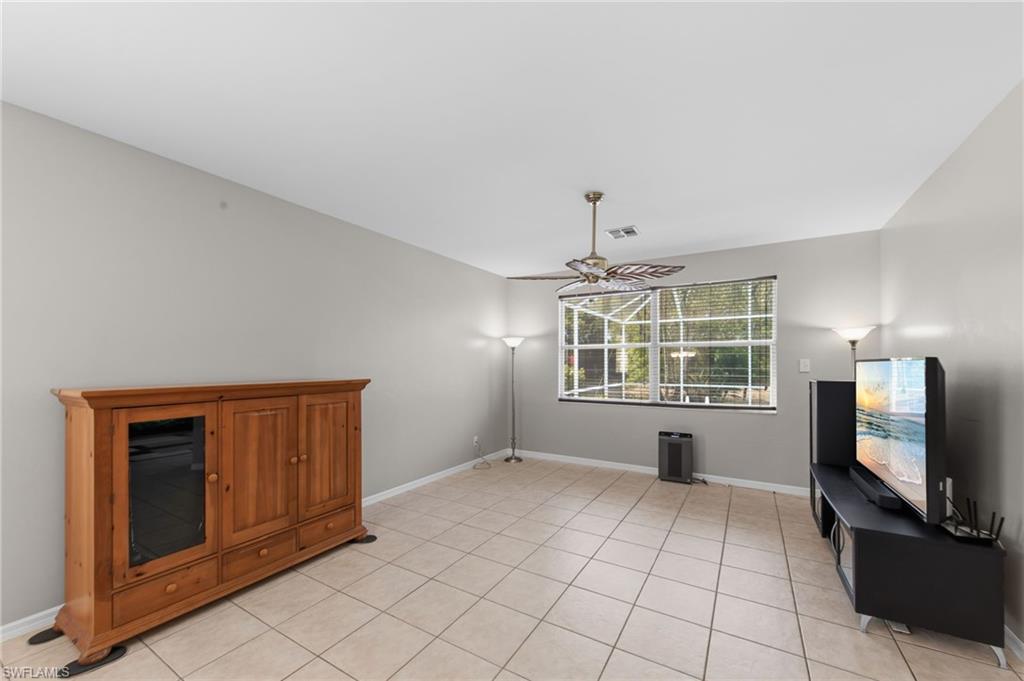 21632 Windham Run Estero, FL 33928 - Photo 4 of 50 a view of an empty room with window and fire place
