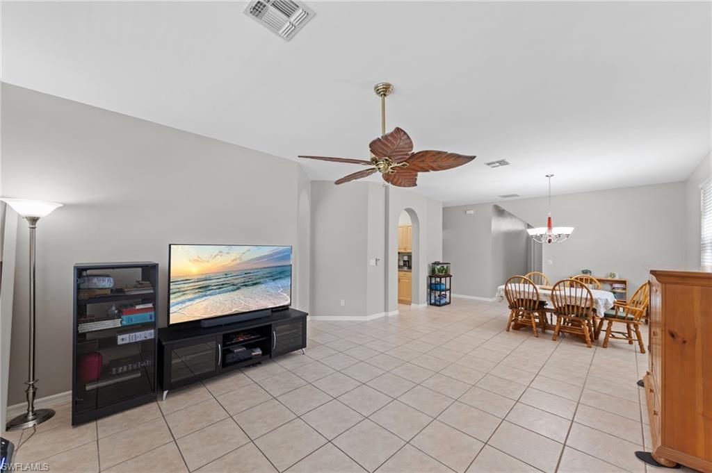 21632 Windham Run Estero, FL 33928 - Photo 6 of 50 a living room with furniture and a flat screen tv