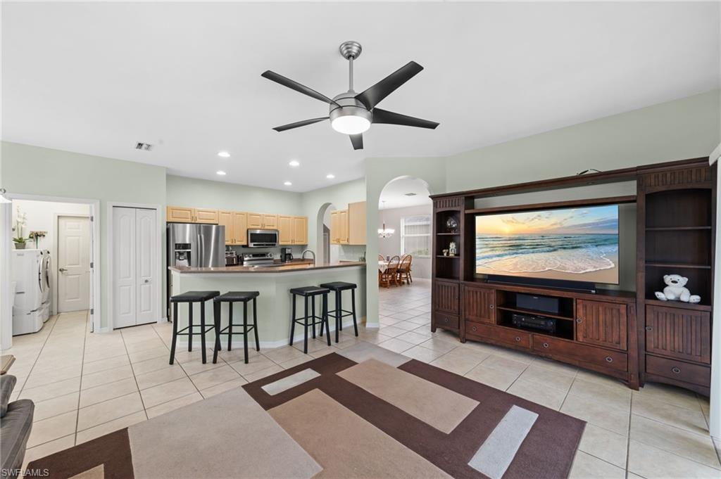21632 Windham Run Estero, FL 33928 - Photo 9 of 50 a view of a living room with furniture and a flat screen tv