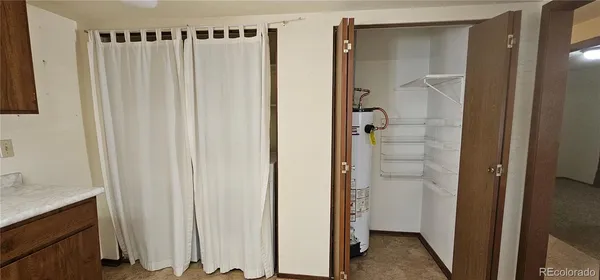 a bathroom with a shower and a sink