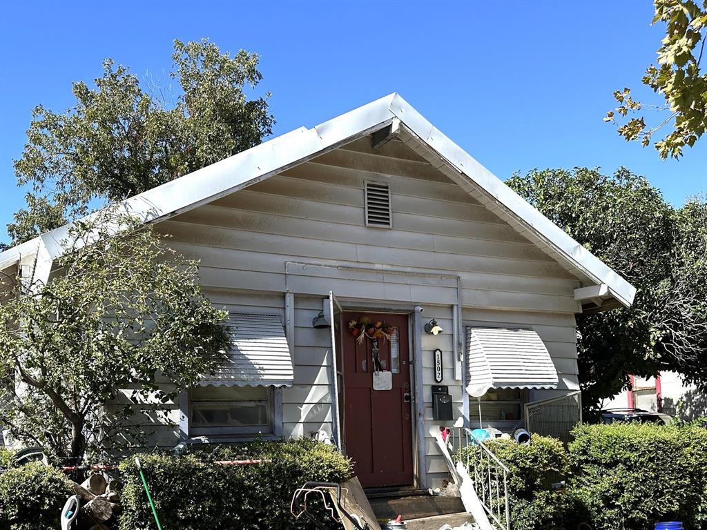 1502 Monroe Street Wichita Falls, TX 76309 - Photo 1 of 13 a front view of a house with a yard