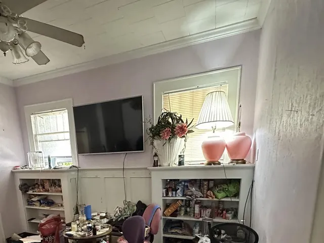 a room with furniture and a flat screen tv