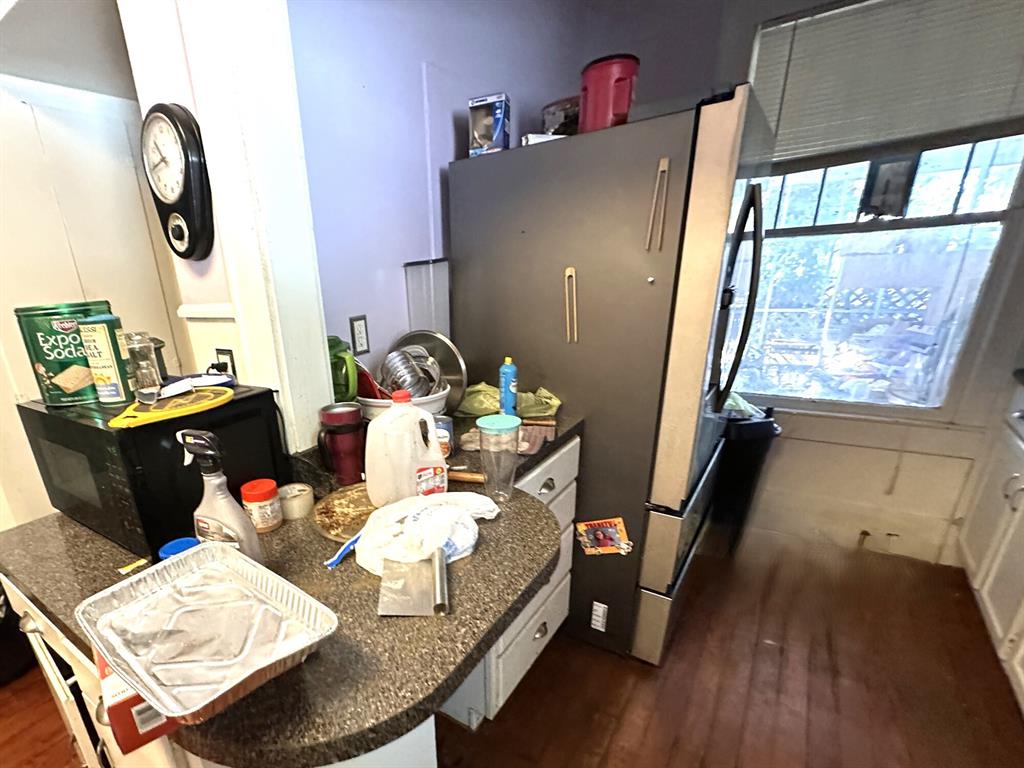 1502 Monroe Street Wichita Falls, TX 76309 - Photo 7 of 13 a dining room with furniture and wooden floor