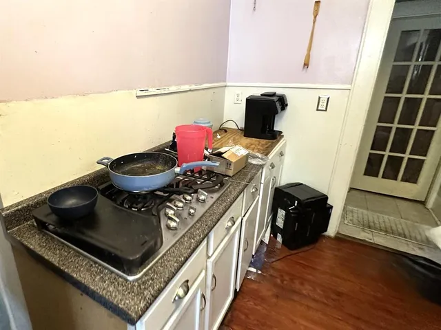 a view of living room with furniture and a rug