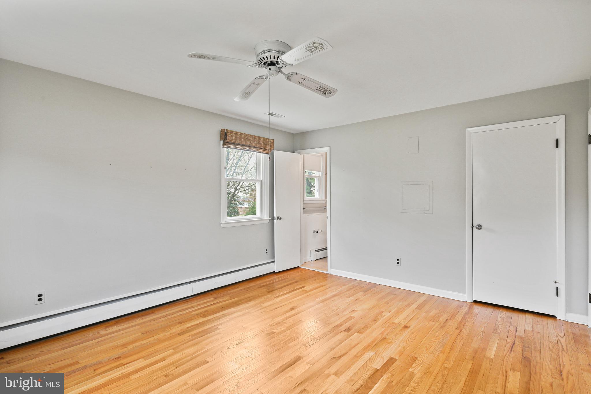 9826 Fox Hill Road Perry Hall, MD 21128 - Photo 15 of 45 wooden floor in an empty room with a window