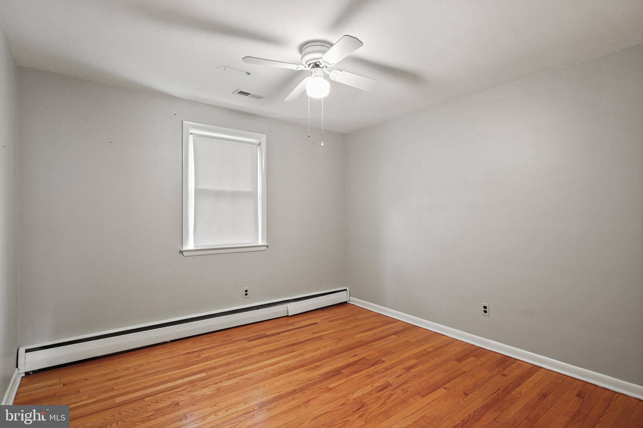 9826 Fox Hill Road Perry Hall, MD 21128 - Photo 17 of 45 wooden floor in an empty room with a window