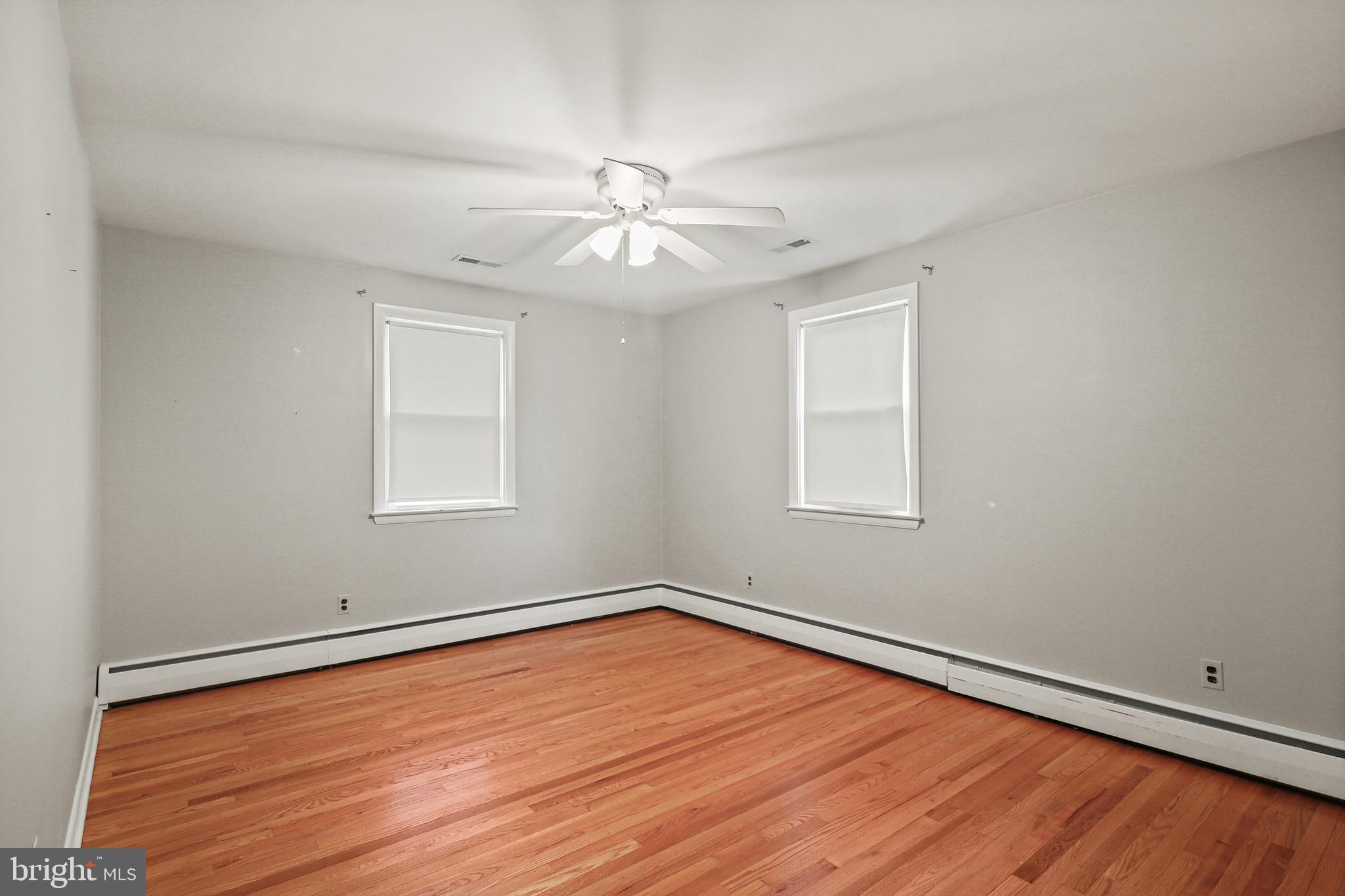9826 Fox Hill Road Perry Hall, MD 21128 - Photo 19 of 45 wooden floor in an empty room with a window