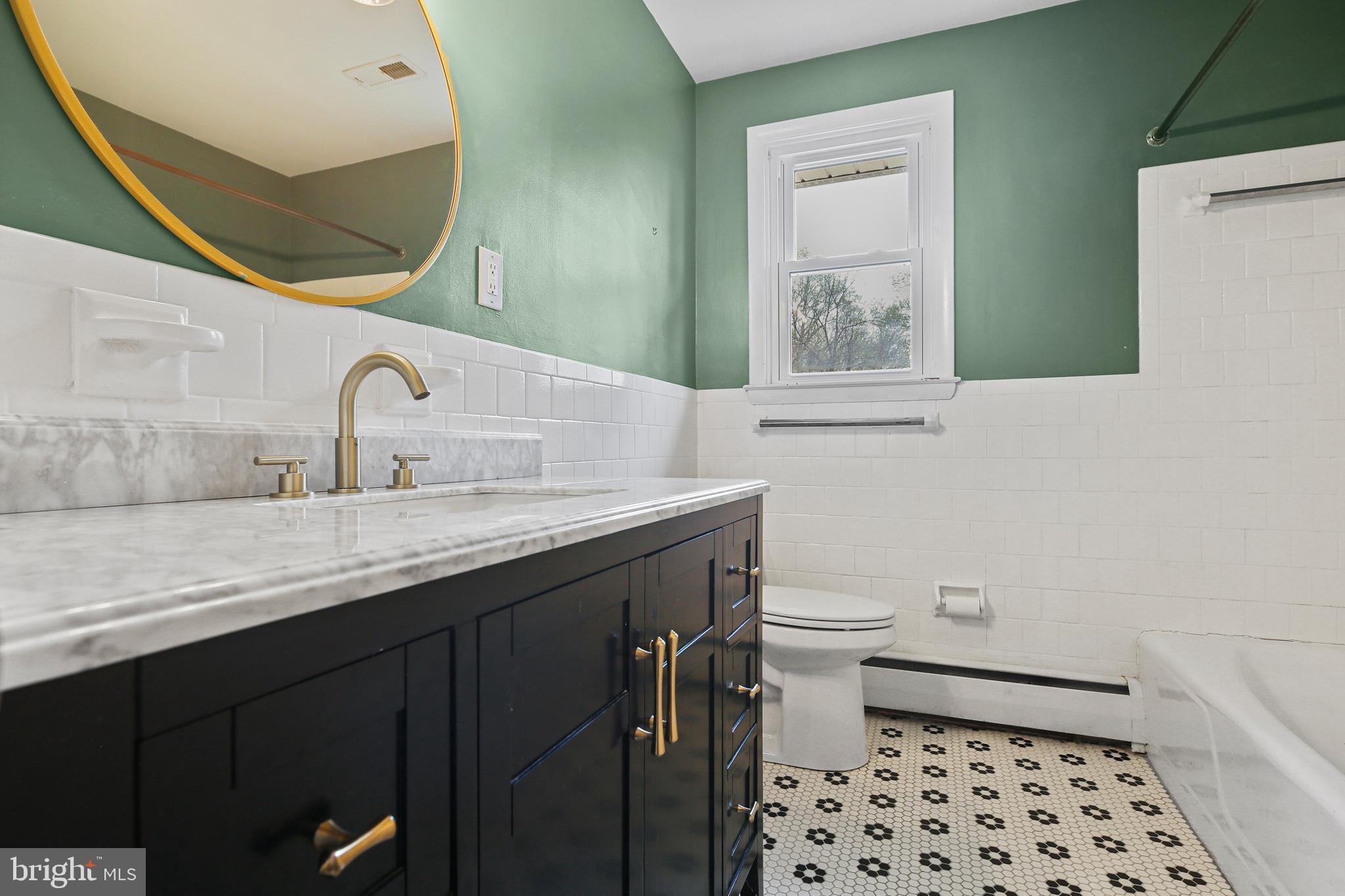 9826 Fox Hill Road Perry Hall, MD 21128 - Photo 20 of 45 a bathroom with a double vanity sink toilet and a mirror