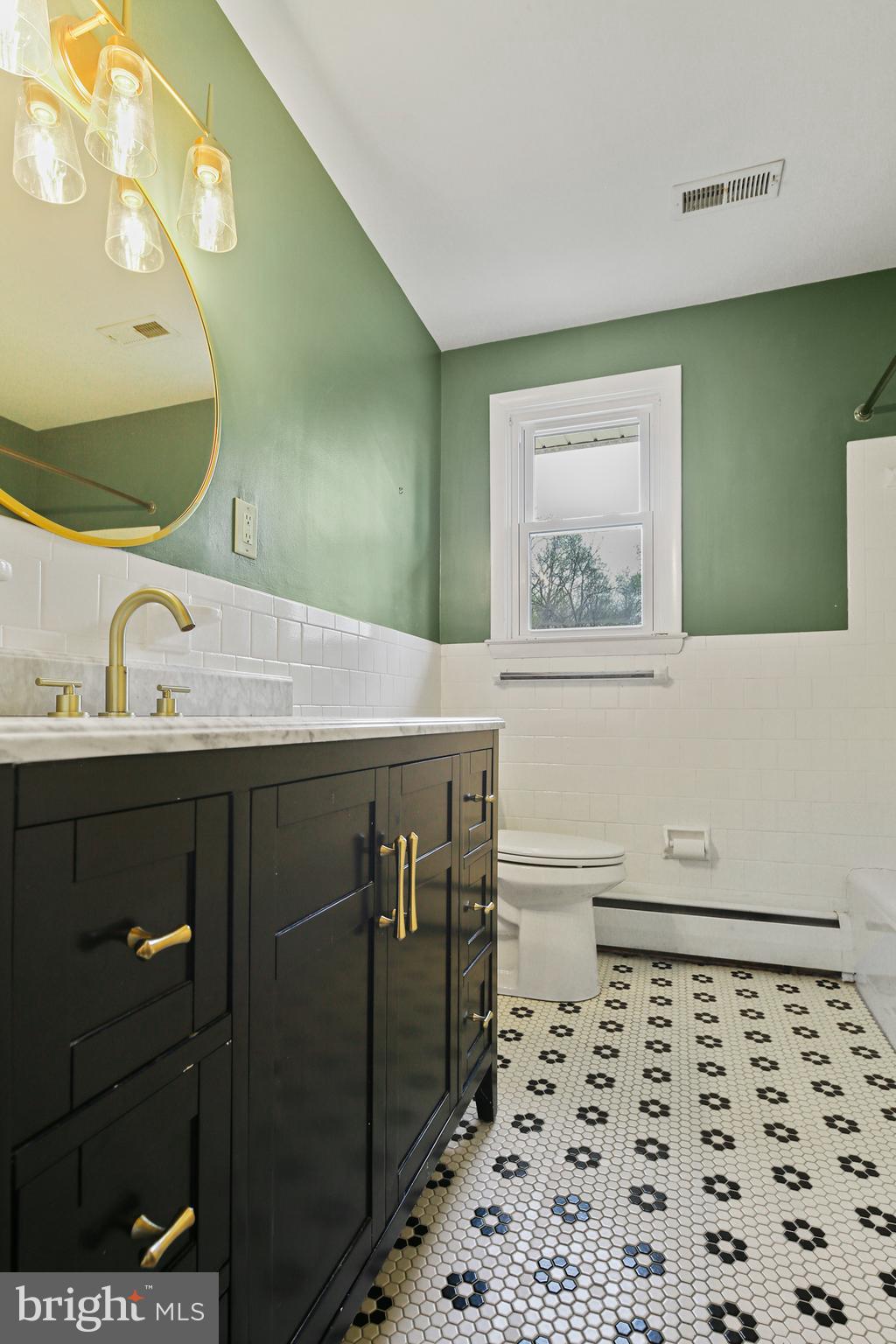 9826 Fox Hill Road Perry Hall, MD 21128 - Photo 21 of 45 a bathroom with a sink and a mirror