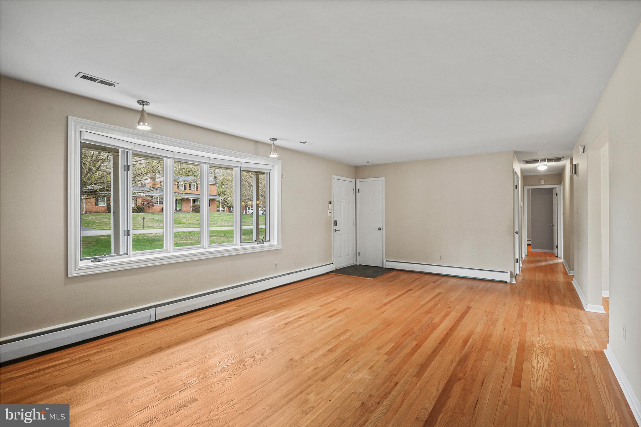 9826 Fox Hill Road Perry Hall, MD 21128 - Photo 9 of 45 wooden floor in an empty room with a window
