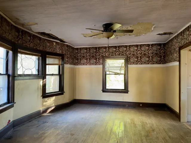a view of an empty room with a window