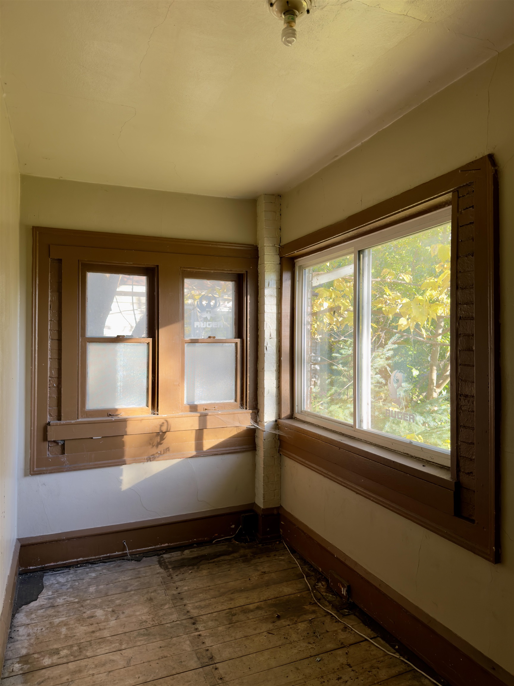 1315 4th Avenue Rockford, IL 61104 - Photo 10 of 14 a bed sitting in a bedroom next to a window