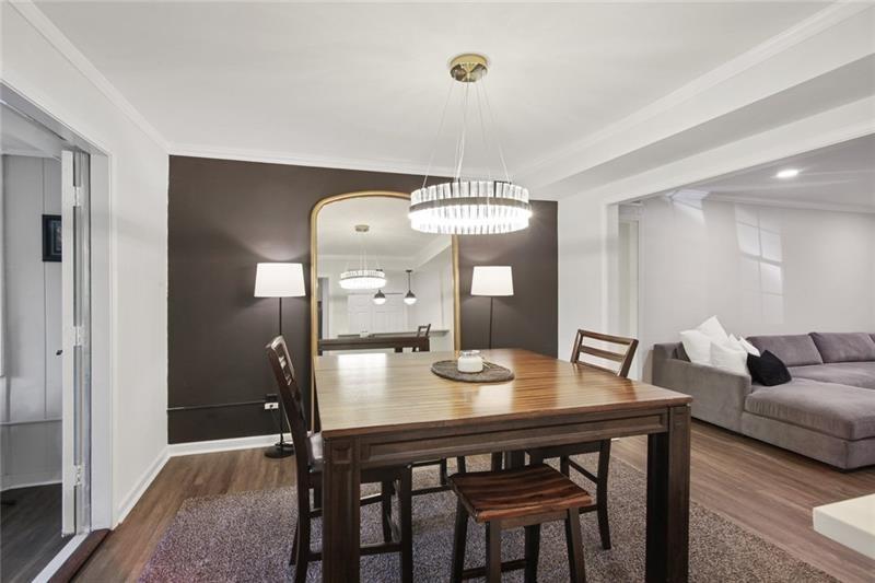162 Elysian Way Northwest Atlanta, GA 30327 - Photo 14 of 32 a view of a dining room with furniture and wooden floor