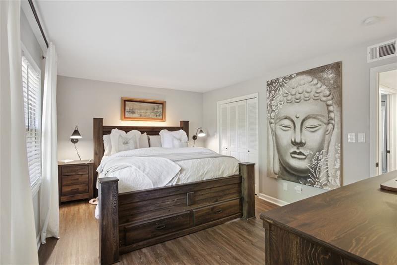 162 Elysian Way Northwest Atlanta, GA 30327 - Photo 17 of 32 a bedroom with a bed and a window