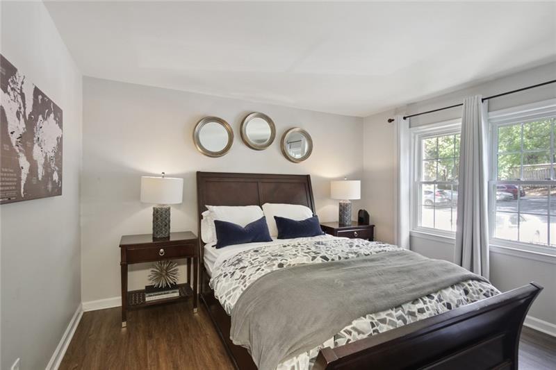 162 Elysian Way Northwest Atlanta, GA 30327 - Photo 19 of 32 a bedroom with a bed and a window