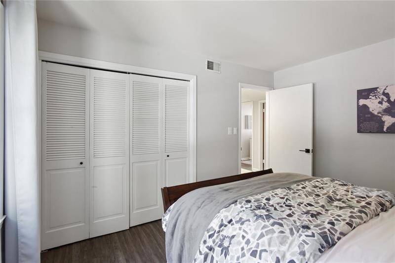 162 Elysian Way Northwest Atlanta, GA 30327 - Photo 20 of 32 a bedroom with a bed and a window