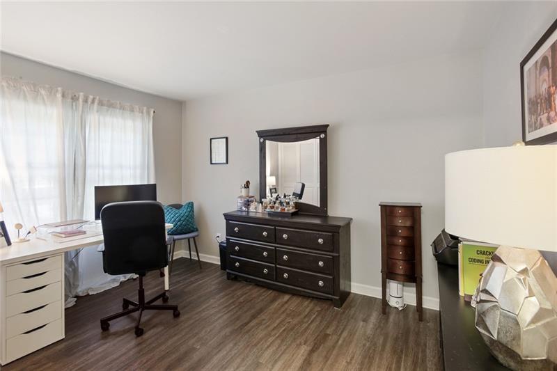162 Elysian Way Northwest Atlanta, GA 30327 - Photo 22 of 32 a room with furniture and wooden floor