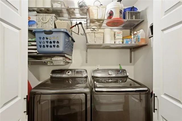 a view of a backyard with table and chairs plants and trees