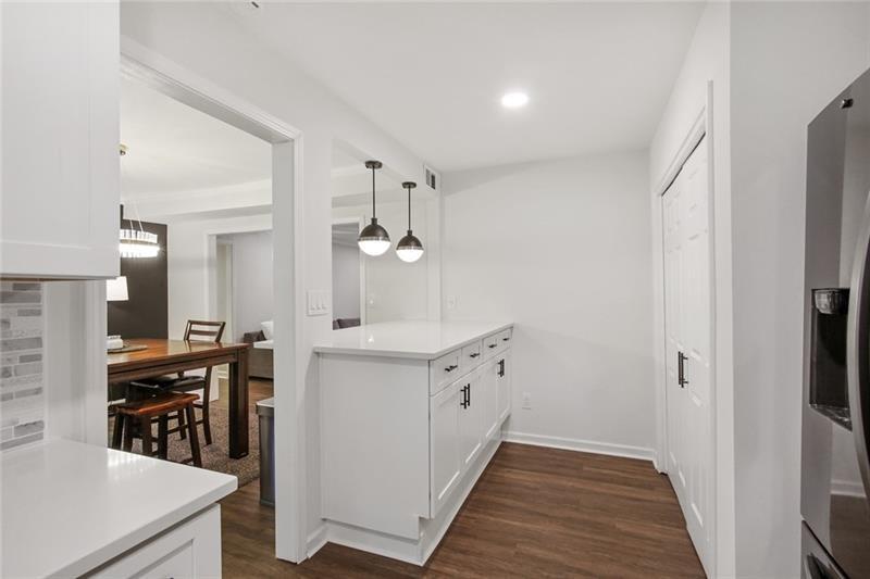 162 Elysian Way Northwest Atlanta, GA 30327 - Photo 5 of 32 a kitchen with cabinets and wooden floor