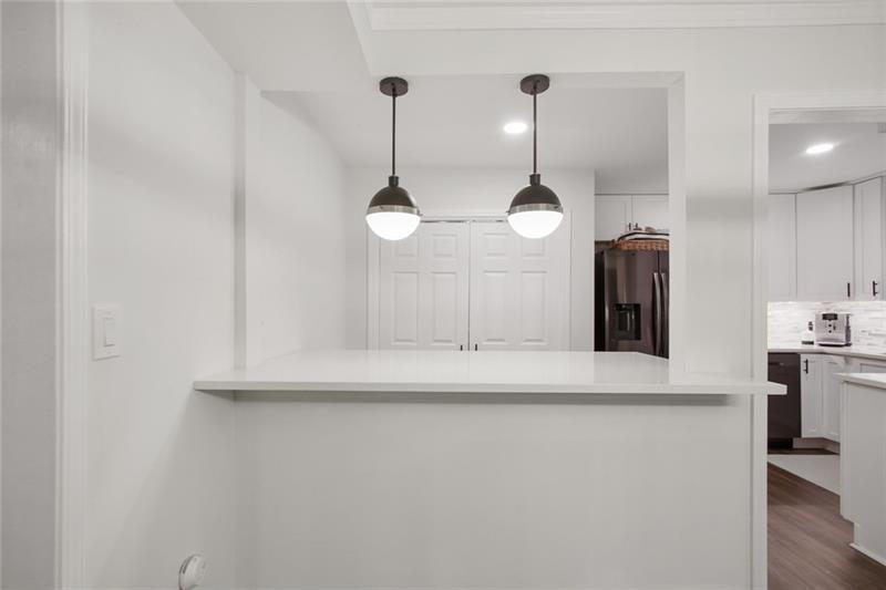 162 Elysian Way Northwest Atlanta, GA 30327 - Photo 6 of 32 a kitchen with kitchen island a center island and wooden floor
