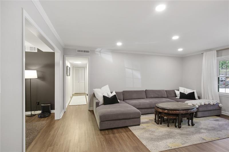 162 Elysian Way Northwest Atlanta, GA 30327 - Photo 9 of 32 a living room with furniture and a wooden floor