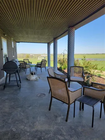 a view of a tables and chairs in patio