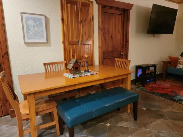 a room with furniture pool table and flat screen tv