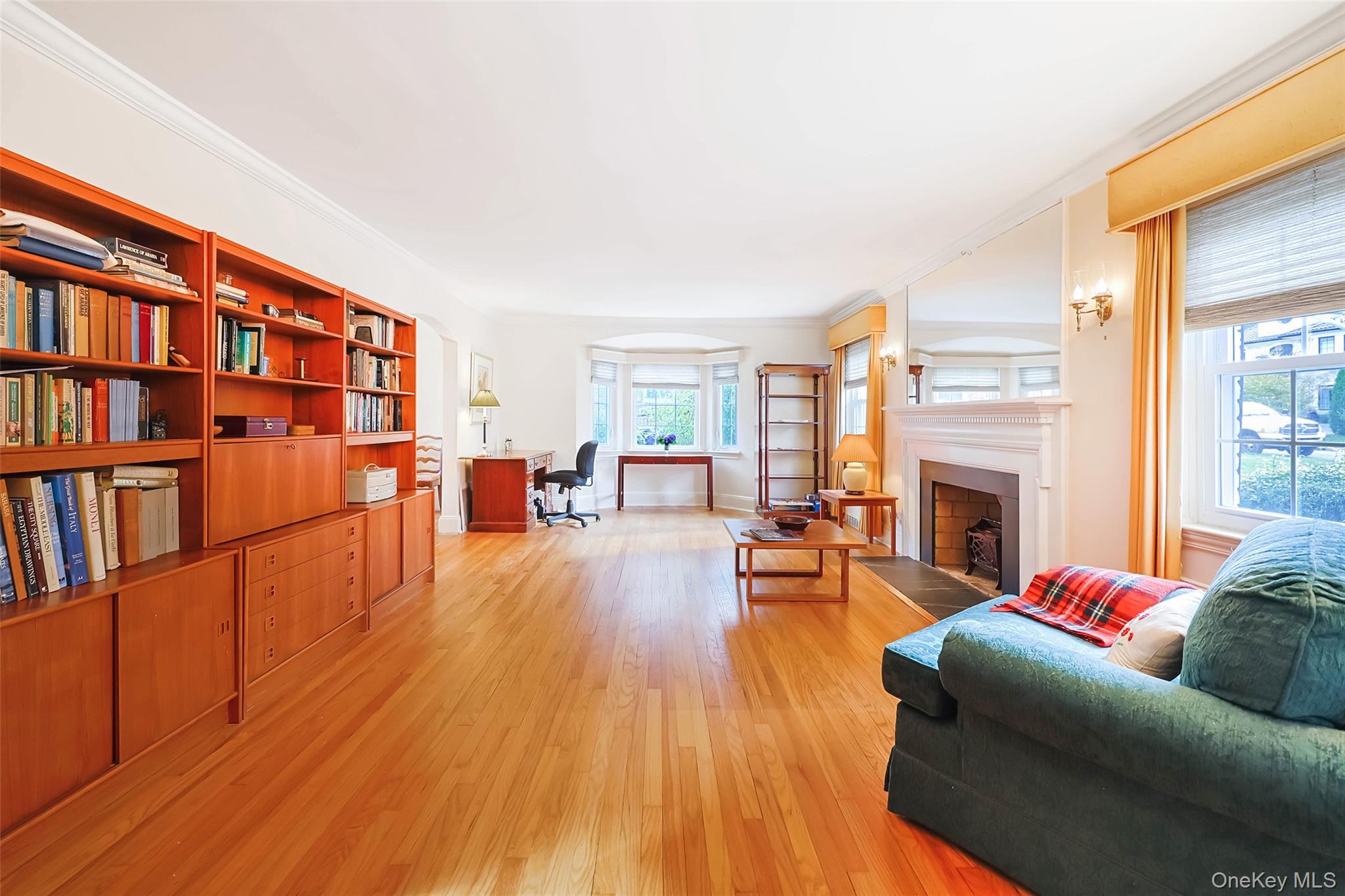 65 Old Mill Road Manhasset, NY 11030 - Photo 4 of 17 a living room with furniture and a fireplace