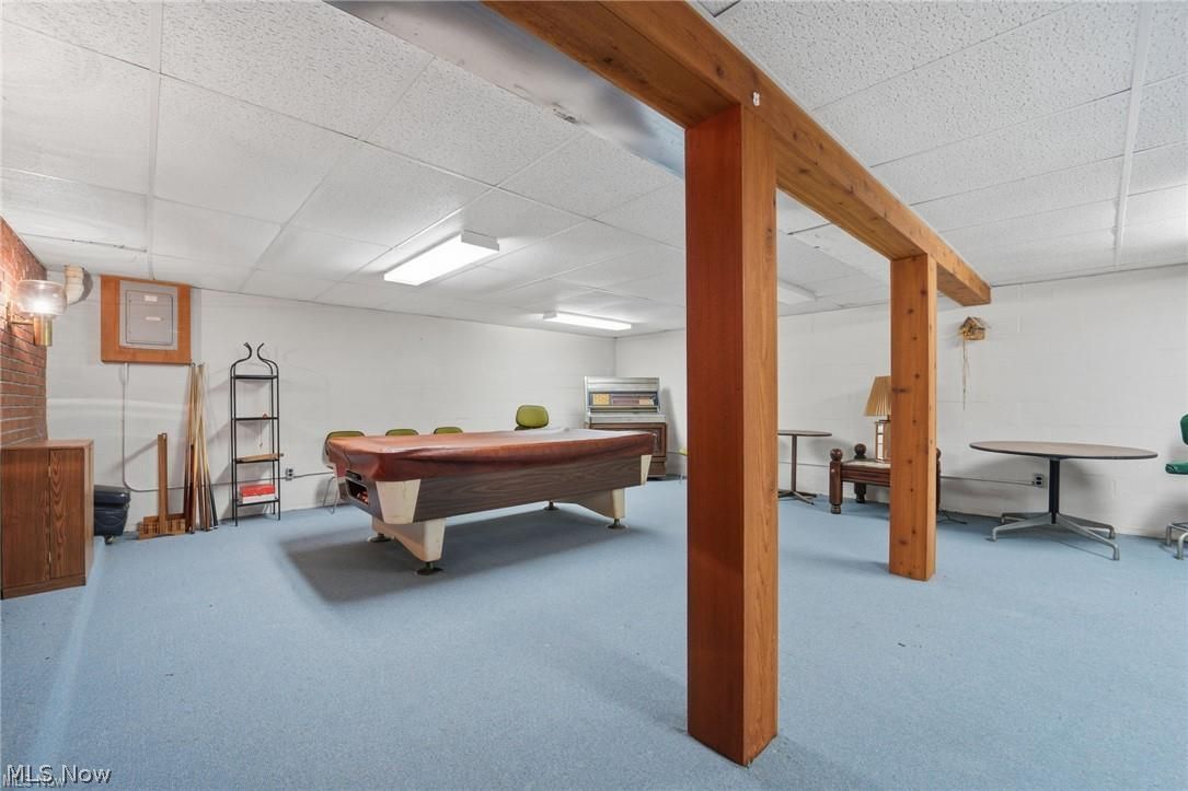 17452 Huntley Road Windsor, OH 44099 - Photo 40 of 49 Playroom featuring a drop ceiling, billiards, concrete block wall, and light colored carpet