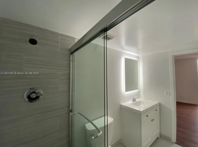 a bathroom with a sink and mirror