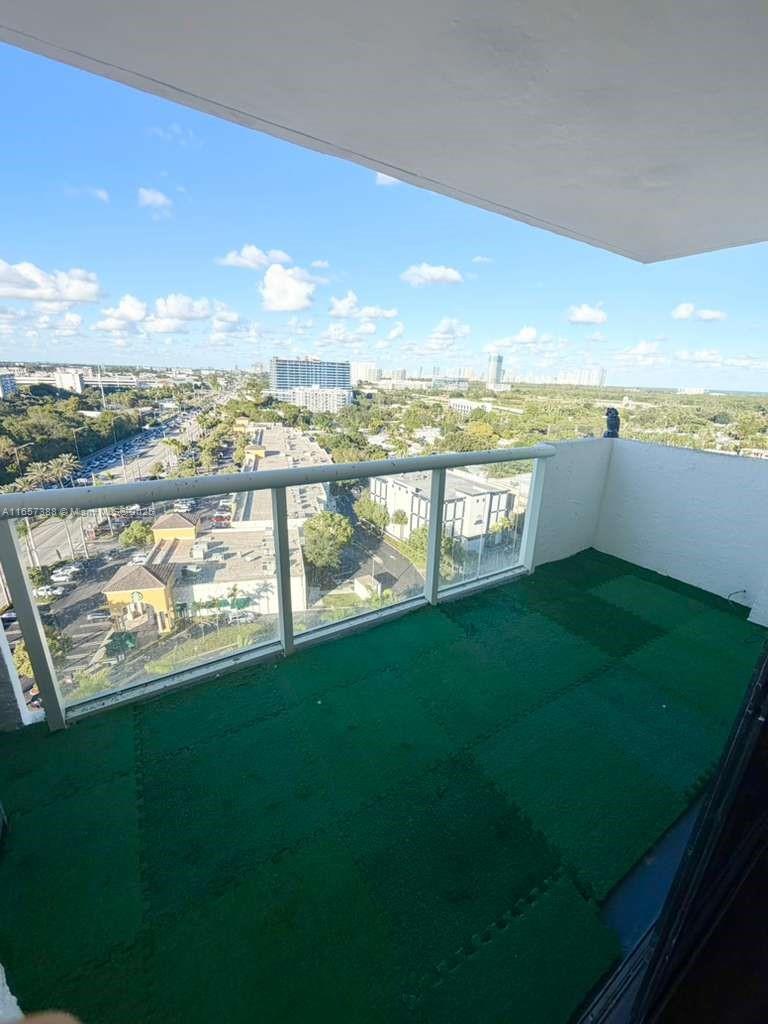 13499 Biscayne Boulevard, Unit 1507 North Miami, FL 33181 - Photo 31 of 32 a view of a lake from a yard