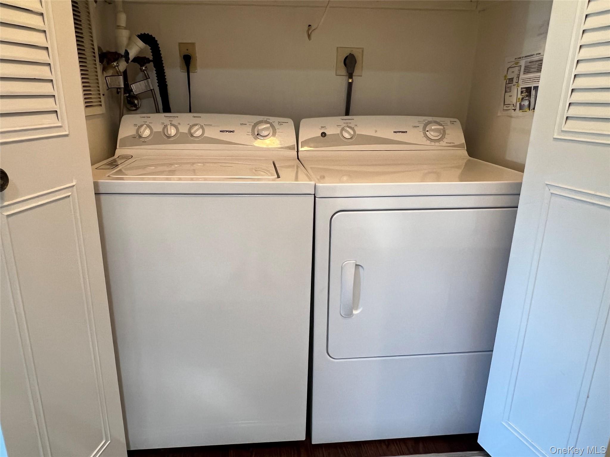 171 B Ventry Court, Unit 171B Ridge, NY 11961 - Photo 14 of 19 a utility room with dryer and washer