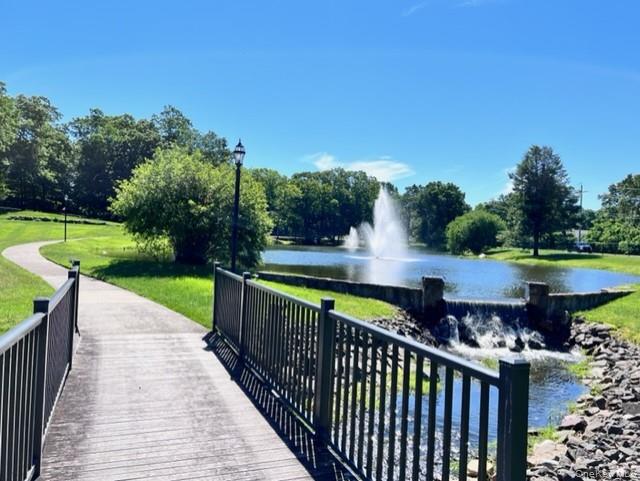 171 B Ventry Court, Unit 171B Ridge, NY 11961 - Photo 17 of 19 a view of a table and chairs on the terrace