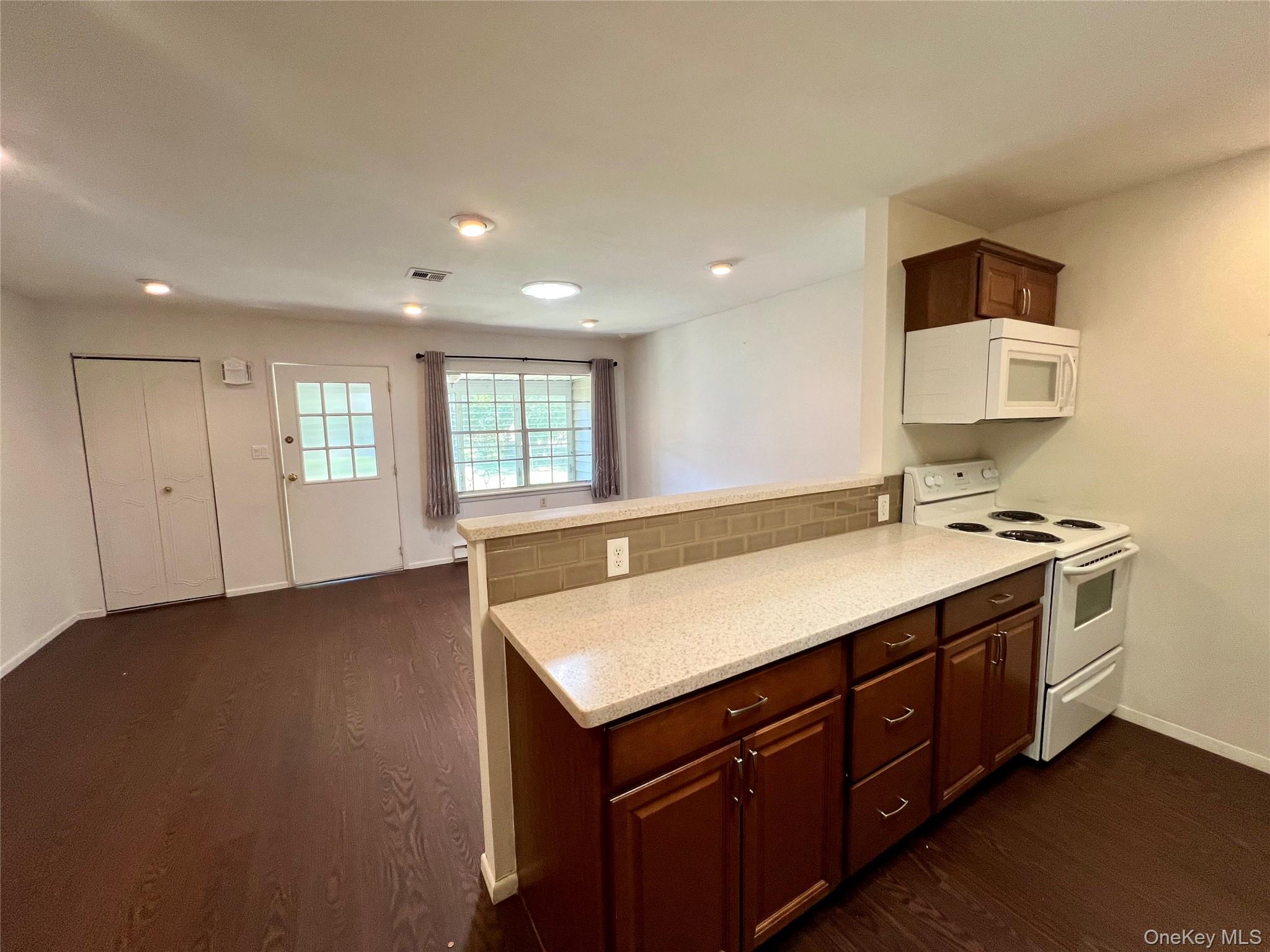 171 B Ventry Court, Unit 171B Ridge, NY 11961 - Photo 8 of 19 a bathroom with a sink and a window