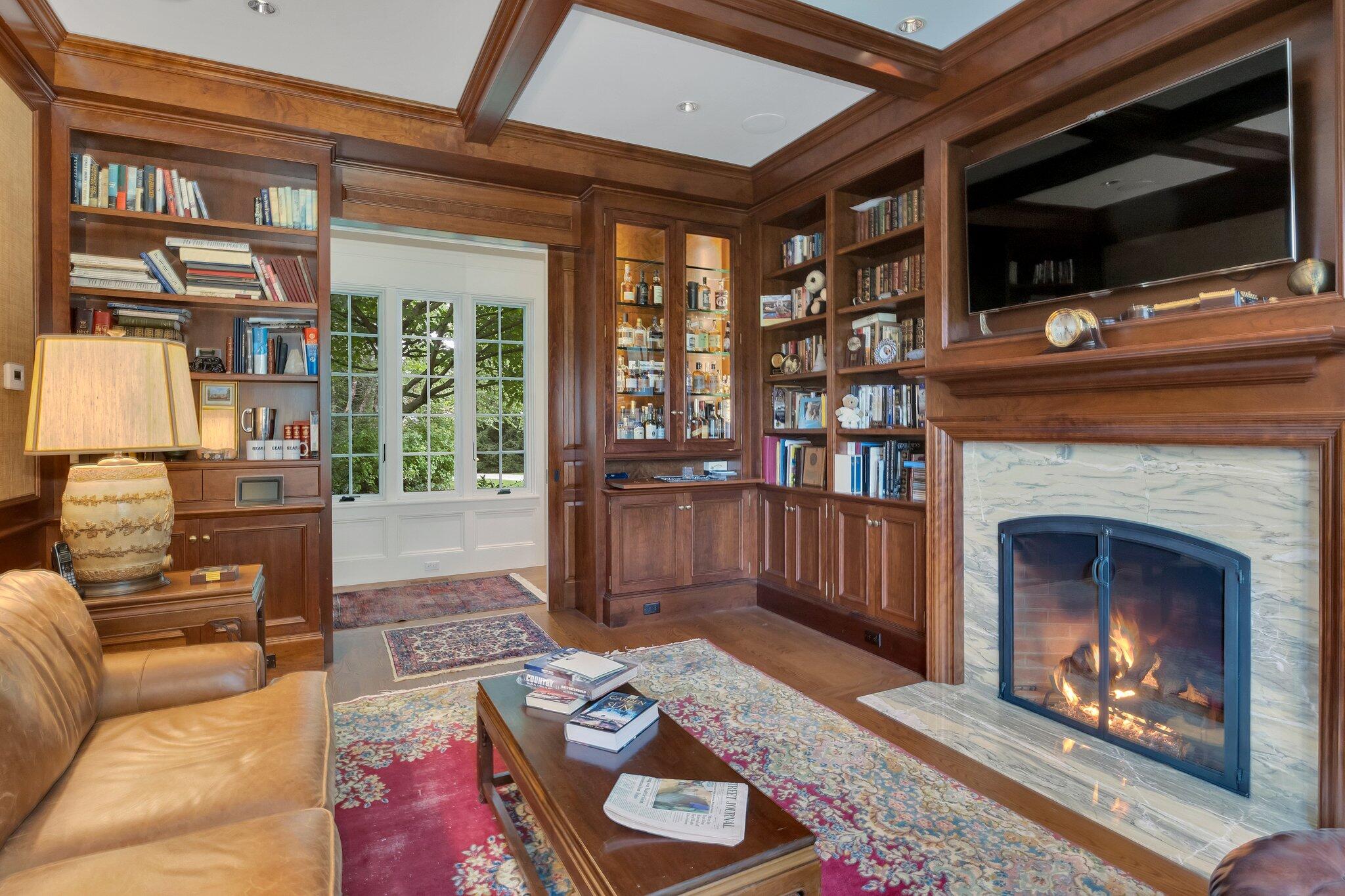 345 Windswept Way Osterville, MA 02655 - Photo 15 of 66 a living room with furniture a flat screen tv and a fireplace