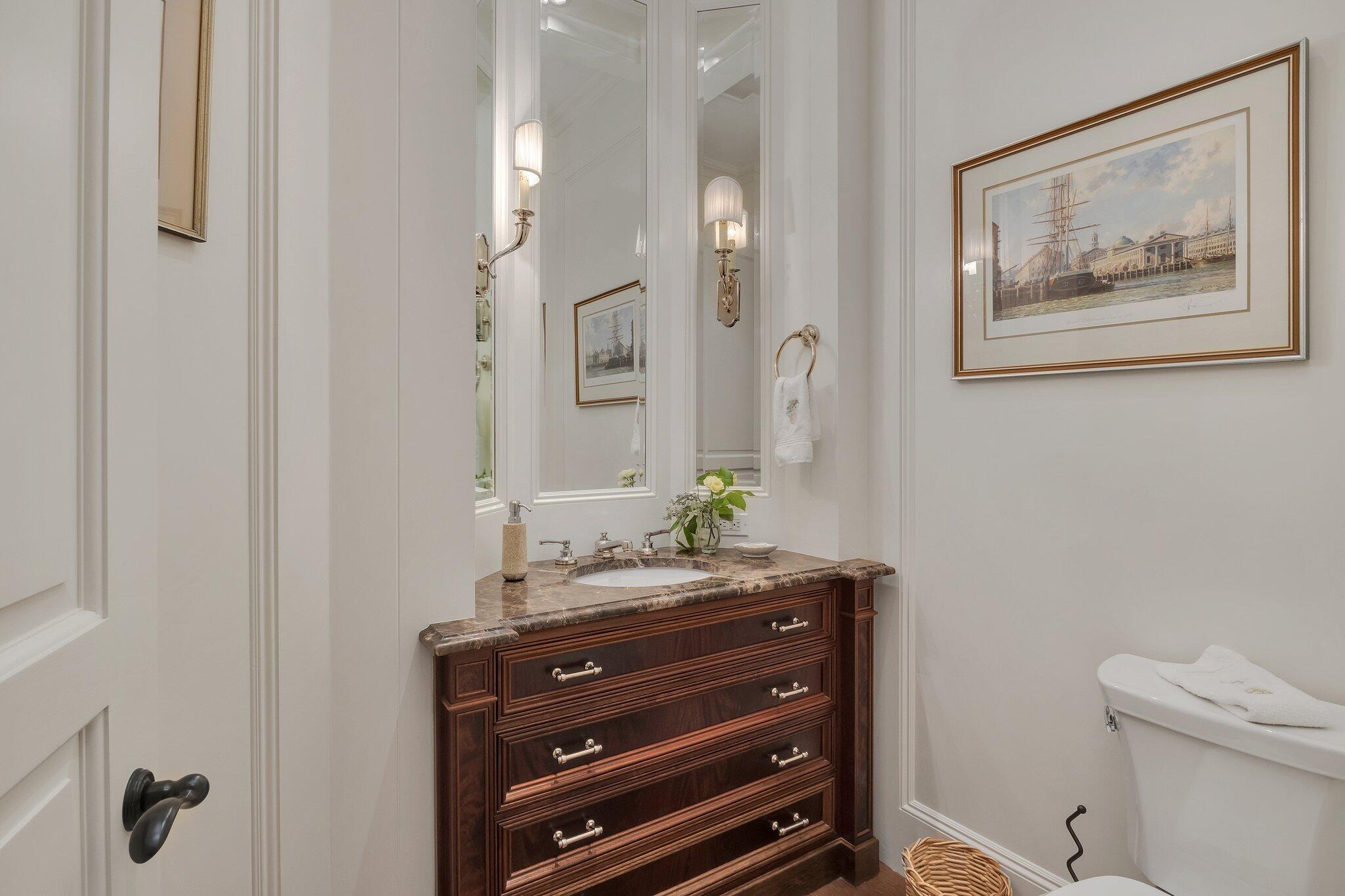 345 Windswept Way Osterville, MA 02655 - Photo 16 of 66 a bathroom with a toilet a sink and a mirror