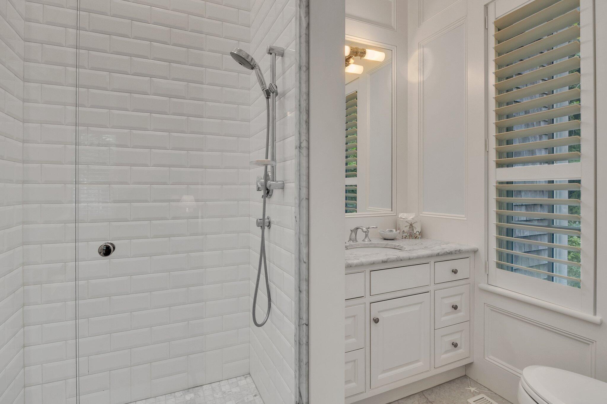 345 Windswept Way Osterville, MA 02655 - Photo 18 of 66 a bathroom with a granite countertop sink a toilet and shower