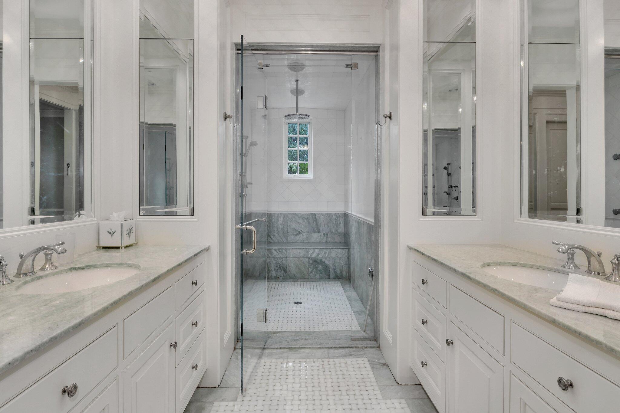 345 Windswept Way Osterville, MA 02655 - Photo 23 of 66 a bathroom with a shower sink and mirror