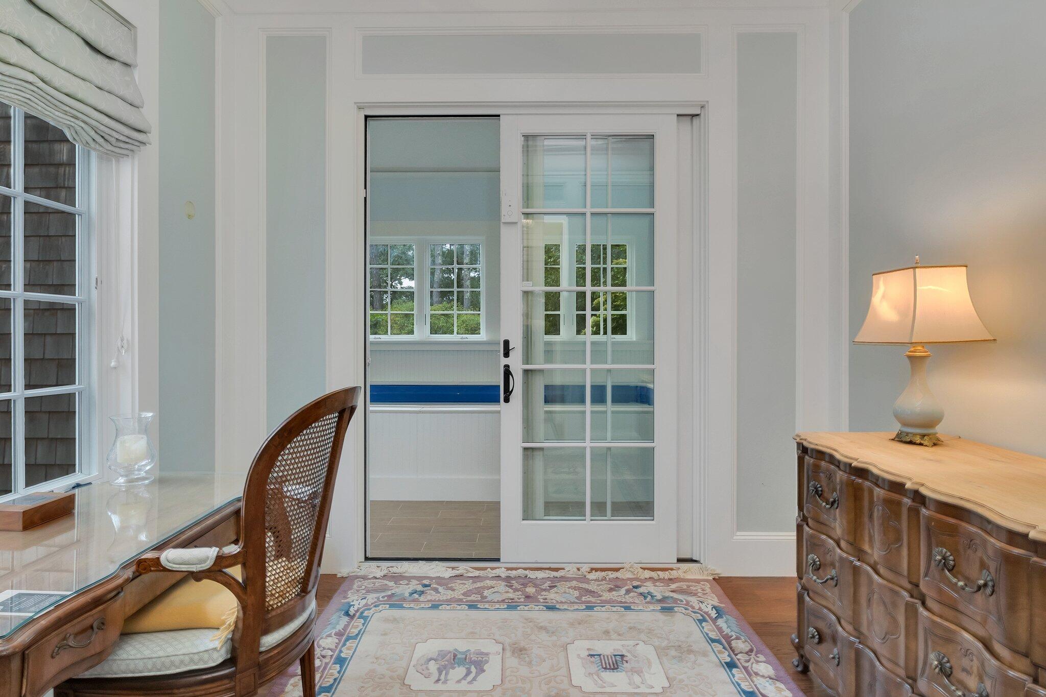 345 Windswept Way Osterville, MA 02655 - Photo 26 of 66 a view of a bedroom with furniture and front door