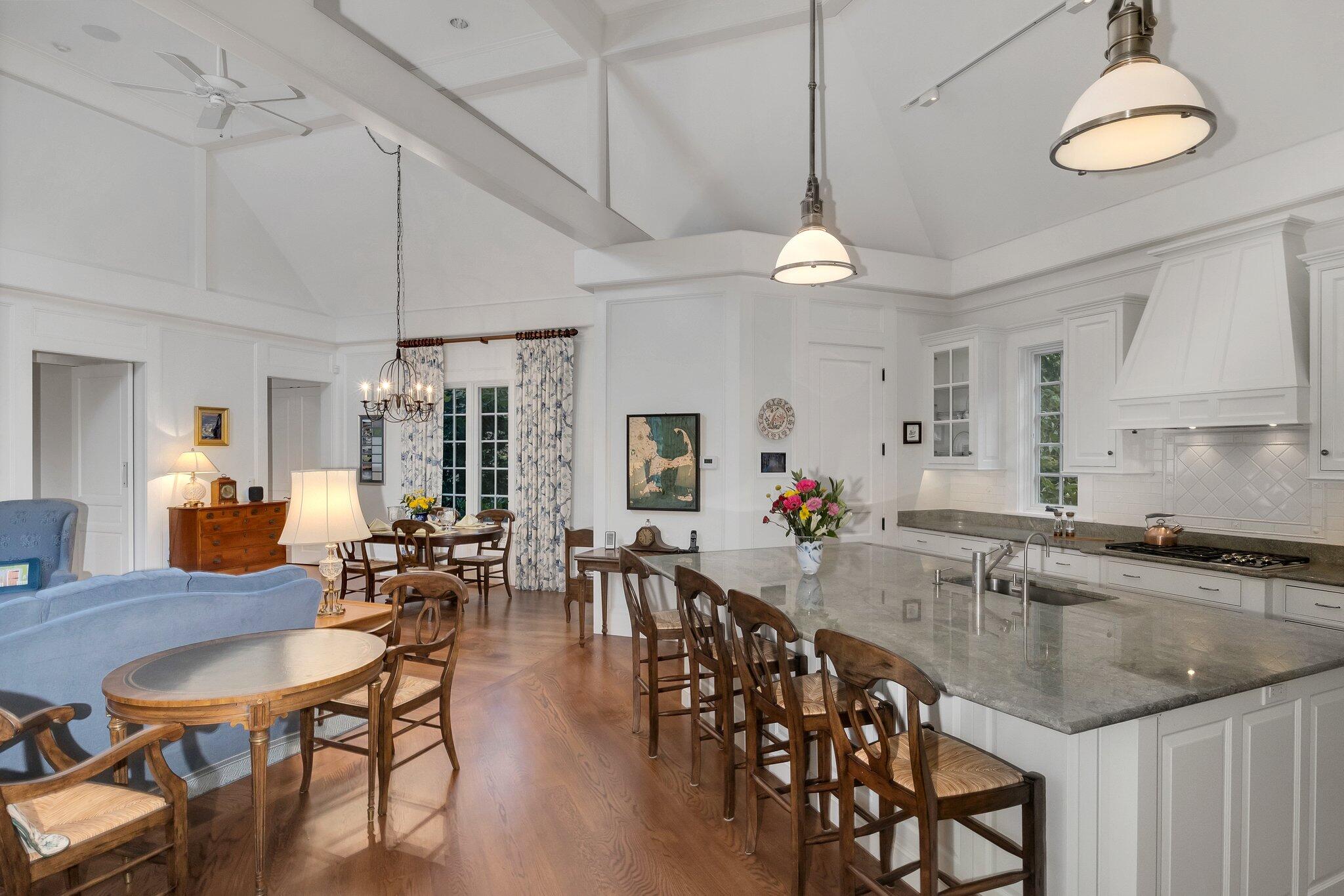 345 Windswept Way Osterville, MA 02655 - Photo 35 of 66 a view of a dining room and livingroom with furniture wooden floor a chandelier