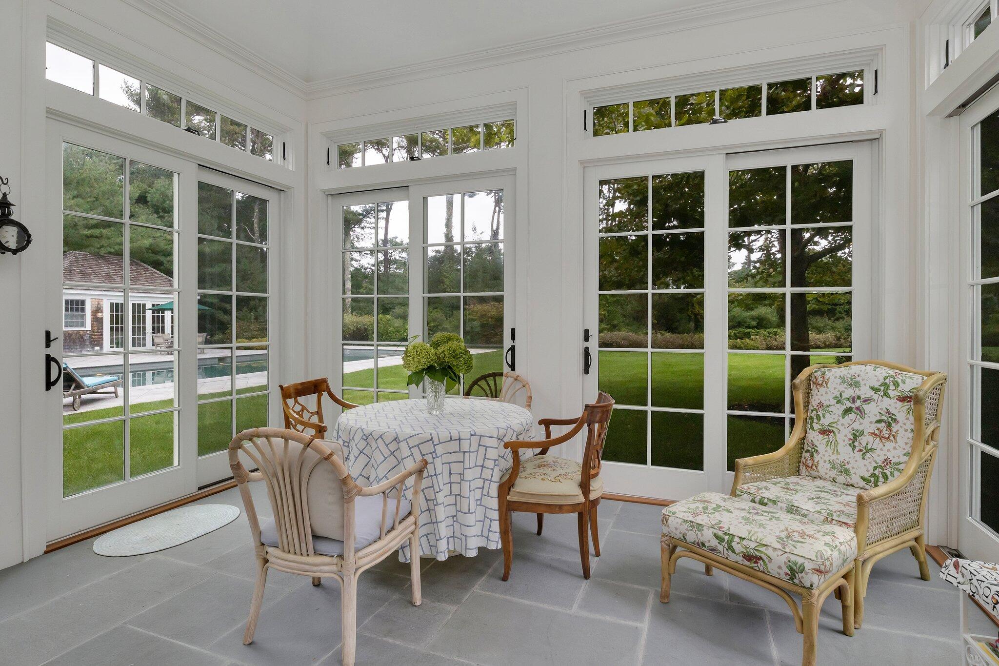345 Windswept Way Osterville, MA 02655 - Photo 39 of 66 a view of a house with backyard and porch