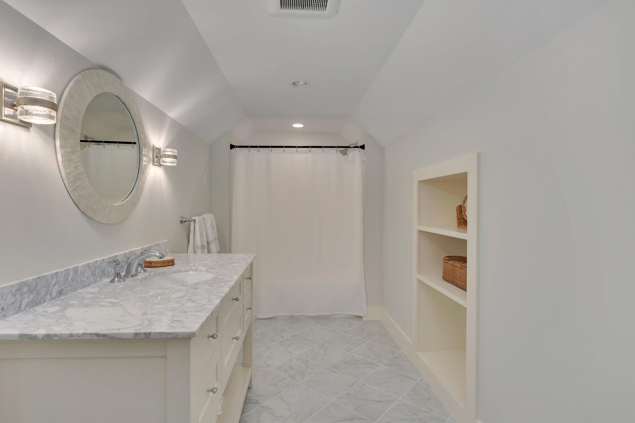 345 Windswept Way Osterville, MA 02655 - Photo 44 of 66 a bathroom with a granite countertop sink a mirror and shower